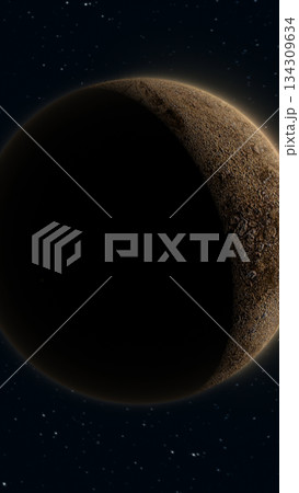 Space scene showing a rocky planet partially in shadow with glowing edges against a starry night sky 134309634