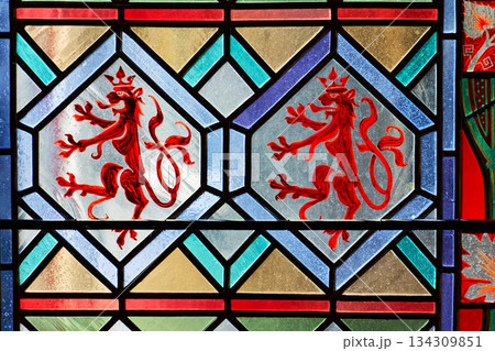 Beautifully illuminated stained glass with historic Czech motifs, colorful light, Gothic atmosphere and architectural heritage in Prague, Czech republic Beautifully illuminated stained glass with historic Czech motifs, colorful light, Gothic atmosphere and architectural heritage in Prague, Czech republic 134309851