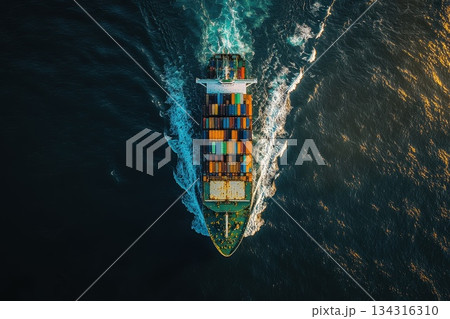 High-Resolution Image of Cargo Ship Sailing Through Ocean Waves at Sunset High-Resolution Image of Cargo Ship Sailing Through Ocean Waves at Sunset 134316310