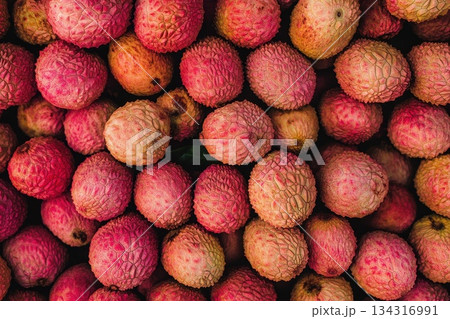 Fresh Vibrant Lychee Fruits Stacked Together for Colorful Wallpaper Background 134316991