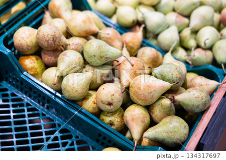 Sweet pear laid out in a container at the market Sweet pear laid out in a container at the market 134317697