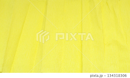 light yellow textured background of crimped wrapping paper 134318306