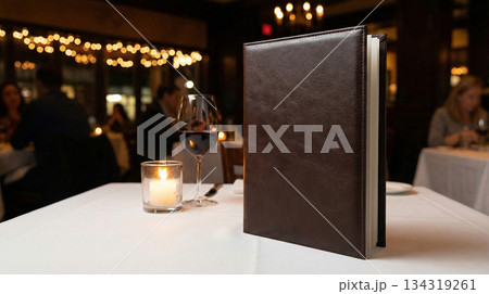 table setting in restaurant with leather menu book 134319261