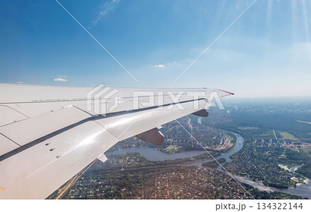 View from the airplane window during taking off on a clear summer morning 134322144