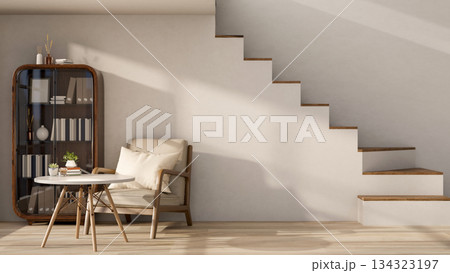 Chair and table aside cabinet on wooden parquet floor with sunlight shining on white wall and stairs 134323197