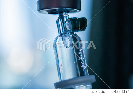 Close up medical intravenous IV drip in hospital background 134323354