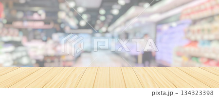 Wood table top with supermarket grocery store blurred background with bokeh light for product display 134323398