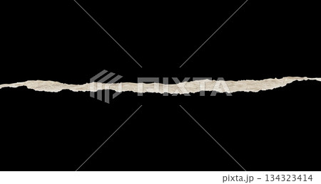 Ripped torn paper edges isolated on black background Ripped torn paper edges isolated on black background 134323414