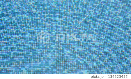 Swimming pool water surface and ripple wave with blue mosaic tiles Swimming pool water surface and ripple wave with blue mosaic tiles 134323435