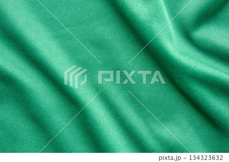 Green sports clothing fabric football shirt jersey texture close up Green sports clothing fabric football shirt jersey texture close up 134323632