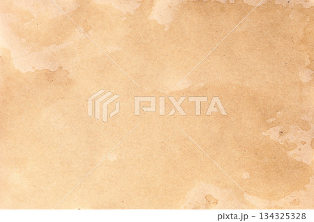 Close-up of aged brown kraft parchment with scattered stains and splatter marks Close-up of aged brown kraft parchment with scattered stains and splatter marks 134325328
