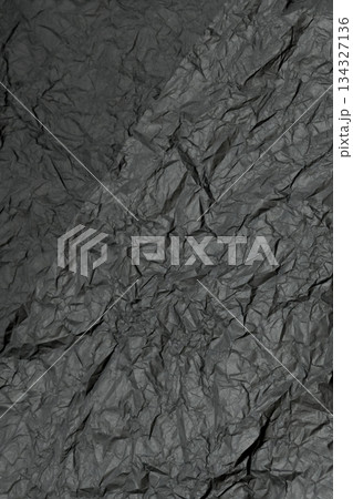 vertical texture of heavily crumpled dark gray paper 134327136