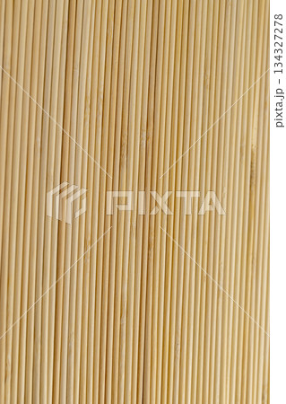 Thin round bamboo sticks are used as supports for indoor or other agricultural plants or for cooking, thin sticks made of bamboo have a wide range of applications from cooking Thin round bamboo sticks are used as supports for indoor or other agricultural plants or for cooking, thin sticks made of bamboo have a wide range of applications from cooking 134327278