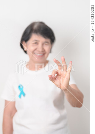 Elderly with blue Ribbon for Prostate Cancer Awareness month, April Child Abuse Prevention, National Bullying, September Addiction Recovery, May Chronic Fatigue Syndrome and January Human Trafficking 134330283