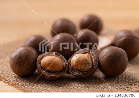 Macadamia nuts on brown background, Close up Macadamia nuts on brown background, Close up 134330706