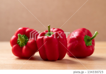 Fresh red bell pepper or sweet pepper on wooden background Fresh red bell pepper or sweet pepper on wooden background 134330723