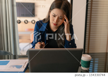 Business woman are under stress from working for poor work, failed work. Business woman are under stress from working for poor work, failed work. 134330744
