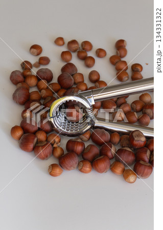 Nutcracker lying on the background of hazelnuts 134331322