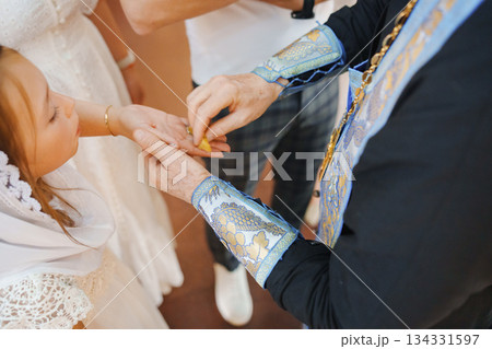 Ceremony of giving blessings to a child at a celebration Ceremony of giving blessings to a child at a celebration 134331597