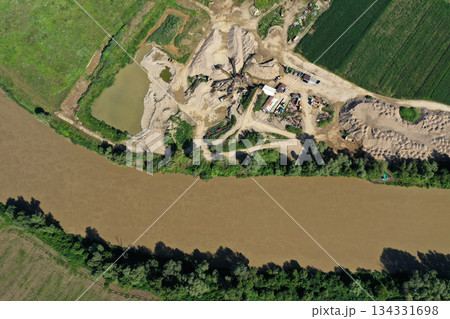 Aerial view of river sand and gravel exploitation, pit, quarry, ballast Aerial view of river sand and gravel exploitation, pit, quarry, ballast 134331698