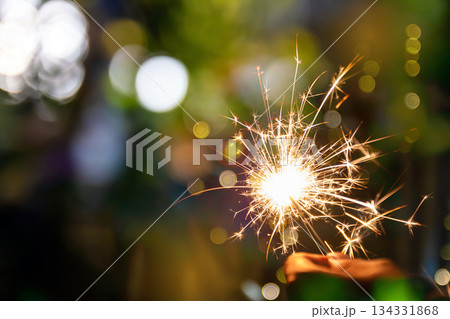 beautiful bokeh of christmas sparkler, holiday background and happy new year creating festive atmosphere for celebration or holiday event beautiful bokeh of christmas sparkler, holiday background and happy new year creating festive atmosphere for celebration or holiday event 134331868