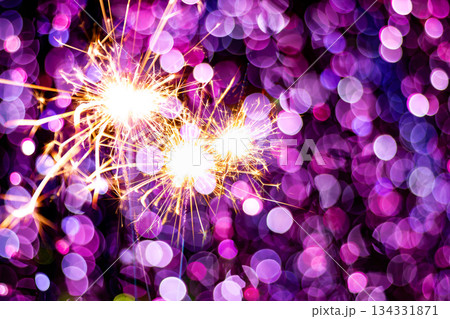 beautiful bokeh of christmas sparkler, holiday background and happy new year creating festive atmosphere for celebration or holiday event 134331871
