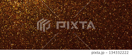 Dark gold sparkling background from small sequins, macro. Shiny bronze glitter backdrop for Christmas or New Year 134332222