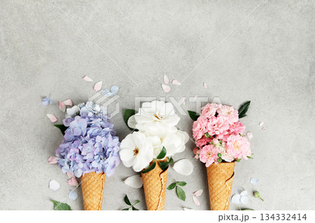 Colorful Flower Bouquets in Waffle Cones on Stone Background Colorful Flower Bouquets in Waffle Cones on Stone Background 134332414