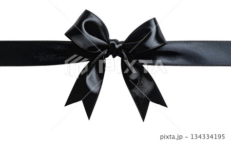 An elegant golden silk bow is an isolated decoration on a white background. An elegant golden silk bow is an isolated decoration on a white background. 134334195