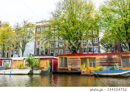 A floating house in Amsterdam canal water. 134334732