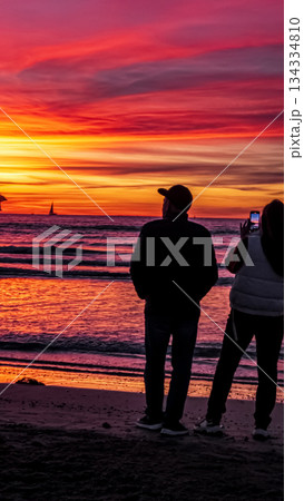 silhouette of a couple on the beach silhouette of a couple on the beach 134334810