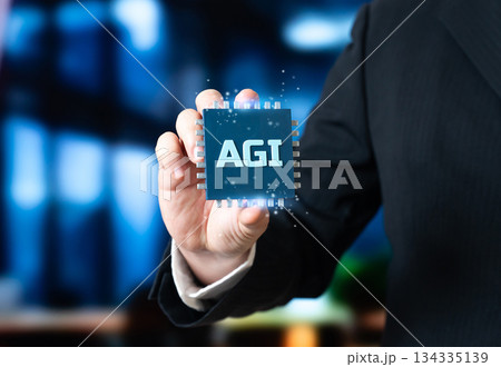 Artificial General Intelligence microchip in the hand of a businessman. A new stage in AI development. Advanced intelligence and transformative economic impact. 134335139