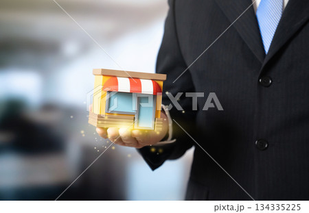A businessman and a store representing a small business. Business management, administration and governance. Entrepreneurship operations, retail control. SME strategy, commerce and policy. A businessman and a store representing a small business. Business management, administration and governance. Entrepreneurship operations, retail control. SME strategy, commerce and policy. 134335225