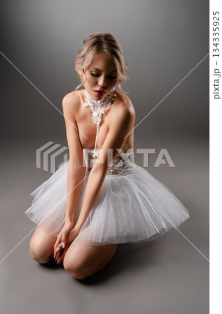 Captivating dance in delicate lingerie set in a beauty studio environment 134335925