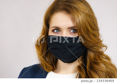 Woman using protective face mask. 134336469