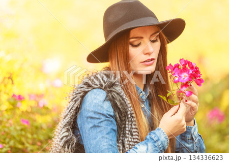Young lady relaxing in garden Young lady relaxing in garden 134336623