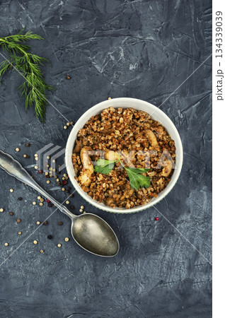 Buckwheat porridge cooked with chicken, top view, copy space. 134339039