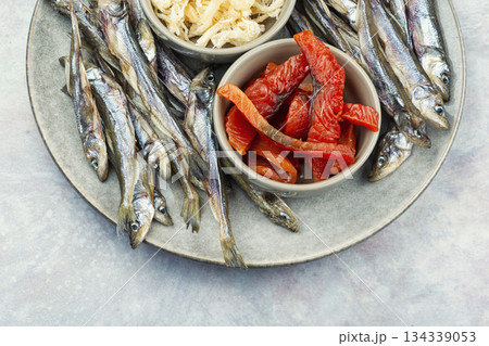 Beer and dried fish. 134339053