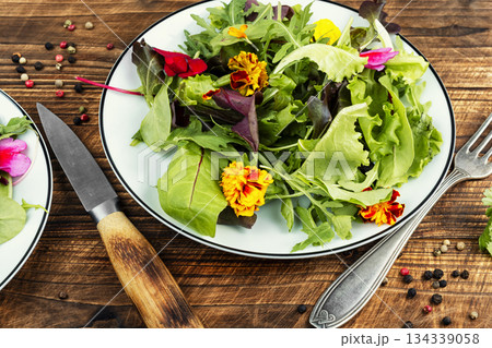 Fresh garden salad with vibrant flowers Fresh garden salad with vibrant flowers 134339058