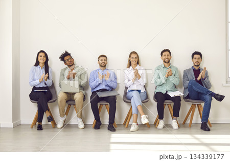 Group of young diverse people clapping hands at a professional business conference 134339177