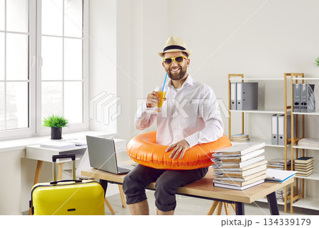 Funny happy male office employee ready to go on summer vacation on his annual leave Funny happy male office employee ready to go on summer vacation on his annual leave 134339179