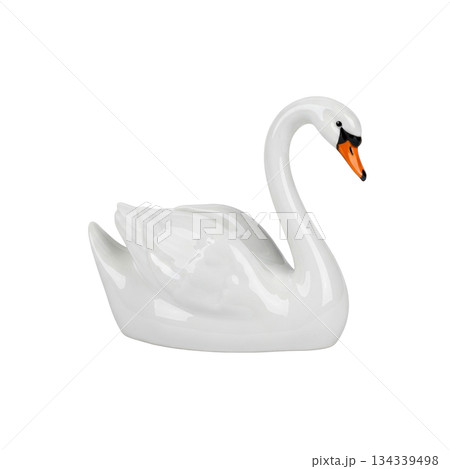 Elegant white porcelain swan figurine swimming with orange beak for home interior decor Elegant white porcelain swan figurine swimming with orange beak for home interior decor 134339498