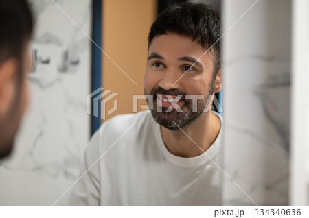 Bearded caucasian young man having his morning washing ritual 134340636