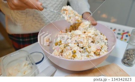 Refreshing potato and ham salad in glowing candle ambiance 134342823