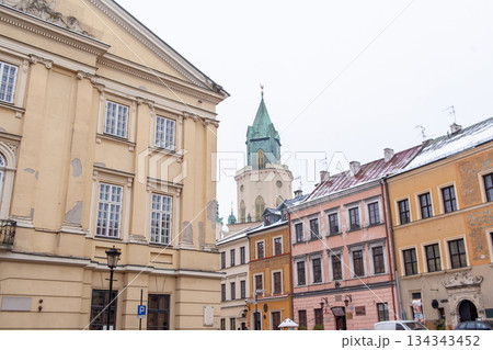 Old building with yellow paint and large windows in city square Old building with yellow paint and large windows in city square 134343452