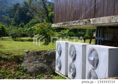 Outdoor AC units beside rural wooden house Outdoor AC units beside rural wooden house 134343514