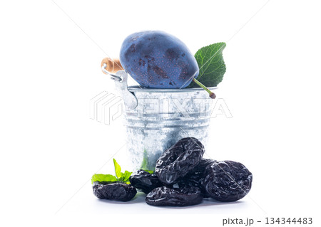 Delicious ripe plums and antioxidant rich dried prunes 134344483