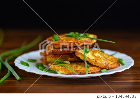 Traditional eastern European potato pancakes with herbs 134344535