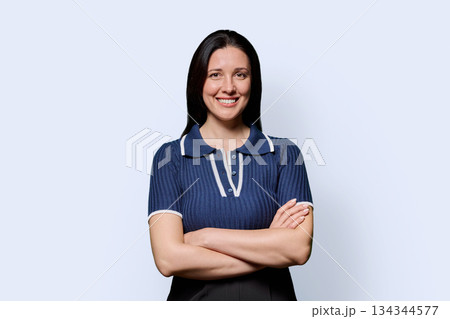 Portrait of beautiful smiling 40 years old woman posing on white background 134344577