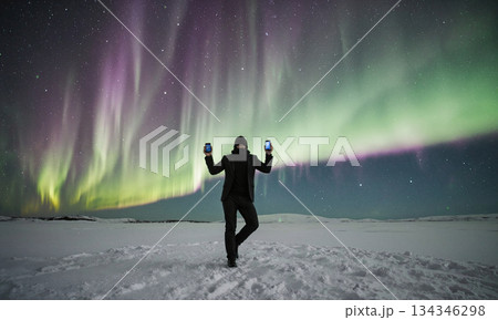 Fintech Aurora Borealis. Dancing under fintech auroras, nomads sync devices to light waves for trades, polar plain background Fintech Aurora Borealis. Dancing under fintech auroras, nomads sync devices to light waves for trades, polar plain background 134346298